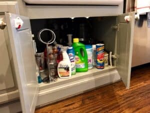 Child safety magnetic locks installed on kitchen cabinets under sink by Infant House